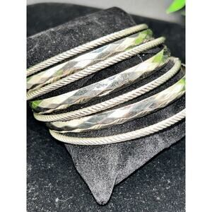Set of 7 High-Polish Silver Tone Interlocking Bangle Bracelets Stacked Statement